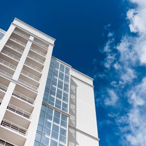 New multi-storey residential building against the blue sky