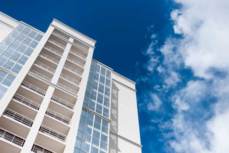 New multi-storey residential building against the blue sky